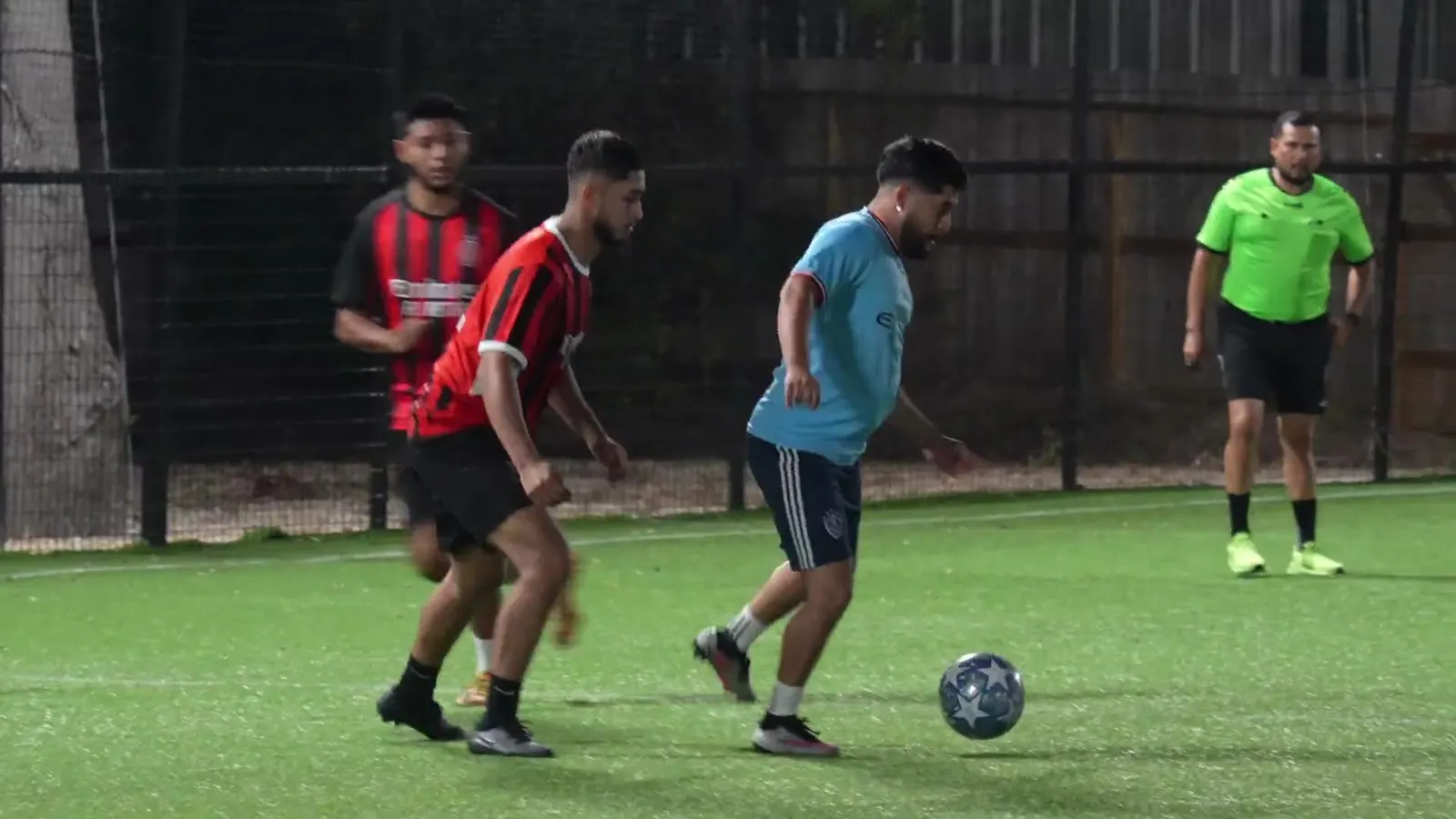 Players in a league match on an outdoor field at The Hattrick Houston